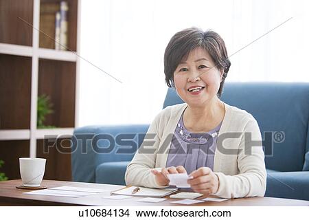 Mature Woman In Living Room View Large Photo Image Picture - Mature Woman In Living Room. Fotosearch