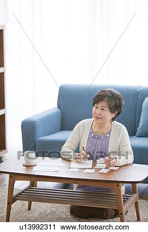 Mature Woman In Living Room View Large Photo Image Stock Image - Mature Woman In Living Room. Fotosearch