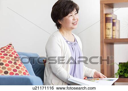 Mature Woman In Living Room View Large Photo Image Stock Photograph - Mature Woman In Living Room. Fotosearch