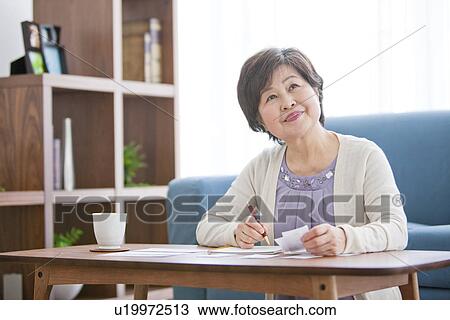 Mature Woman Thinking In Living Room View Large Photo Image Stock Image - Mature Woman Thinking In Living Room. Fotosearch