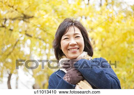 Mature Woman Walking In the Woods In Autumn View Large Photo Image Stock Image - Mature Woman Walking In the Woods In Autumn. Fotosearch