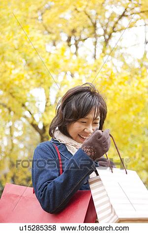 Mature Woman Walking In the Woods In Autumn View Large Photo Image Stock Photo - Mature Woman Walking In the Woods In Autumn. Fotosearch