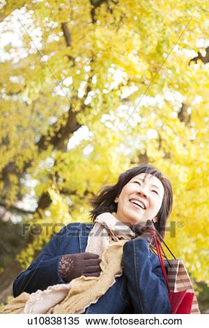 Mature Woman Walking In the Woods In Autumn View Large Photo Image Stock Photography - Mature Woman Walking In the Woods In Autumn. Fotosearch