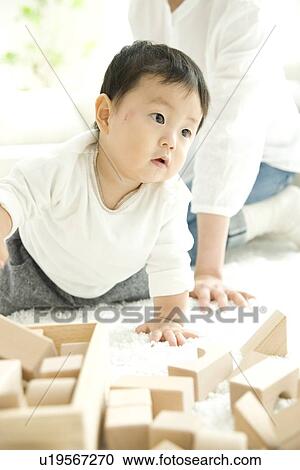 Mother and baby in living room View Large Photo Image Stock Image - Mother and baby in living room. Fotosearch