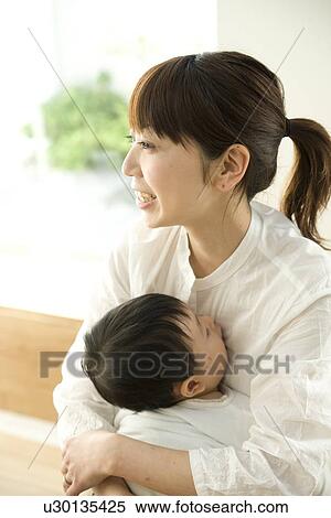 Mother hugging baby View Large Photo Image Stock Photography - Mother hugging baby. Fotosearch