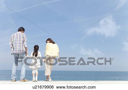Parents and Daughter Standing on Beach View Large Photo Image Stock Photograph - Parents and Daughter Standing on Beach. Fotosearch