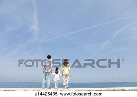 Parents and Daughter Standing on Beach View Large Photo Image Stock Photography - Parents and Daughter Standing on Beach. Fotosearch