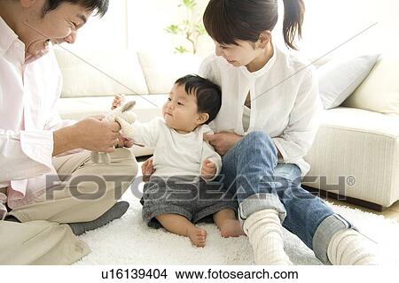 Parents playing with baby boy View Large Photo Image Picture - Parents playing with baby boy. Fotosearch