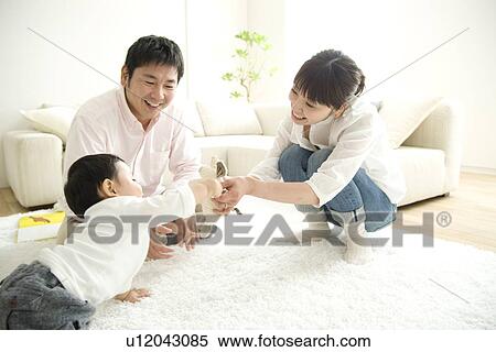 Parents playing with baby boy View Large Photo Image Stock Photography - Parents playing with baby boy. Fotosearch