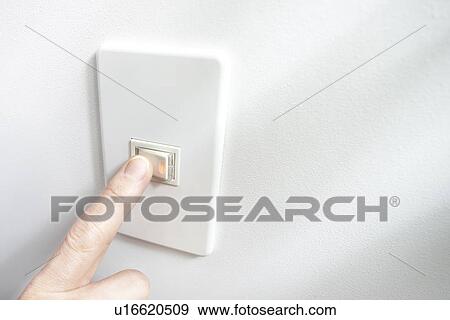 Stock Photo - Person Turning on Switch. Fotosearch