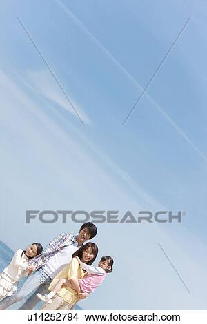 Portrait of Family of Four on Beach View Large Photo Image Picture - Portrait of Family of Four on Beach. Fotosearch
