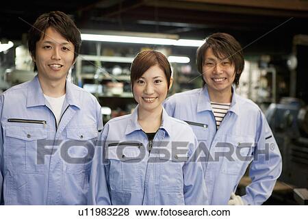 Stock Photo - Portrait of Three Factory Workers. Fotosearch