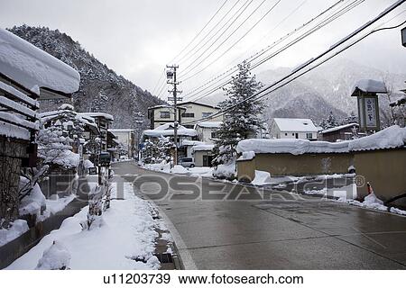 Road in snowcapped village View Large Photo Image Stock Photo - Road in snowcapped village. Fotosearch