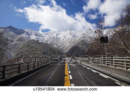 Road near mountains View Large Photo Image Picture - Road near mountains. Fotosearch