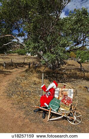 Stock Photo - Santa Claus decoration on roadside. Fotosearch