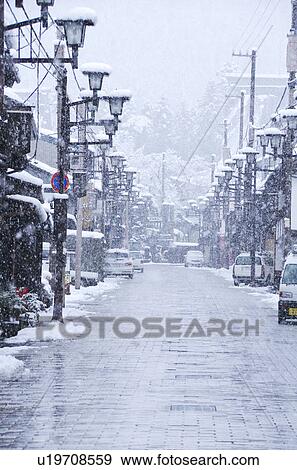 Stock Photo - Snow Falling In City. Fotosearch