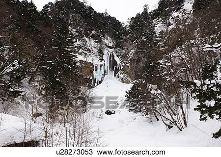 Snowcapped cliff and frozen waterfall View Large Photo Image Stock Image - Snowcapped cliff and frozen waterfall. Fotosearch