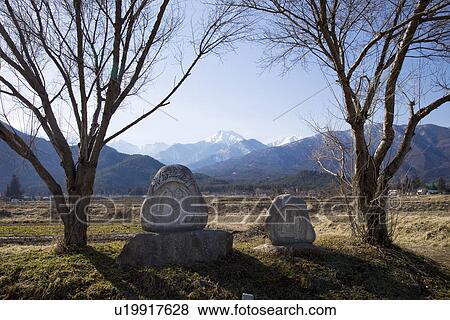 Snowcapped mountain chain behind monument View Large Photo Image Stock Photo - Snowcapped mountain chain behind monument. Fotosearch