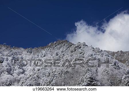 Snowcapped mountain peak View Large Photo Image Picture - Snowcapped mountain peak. Fotosearch
