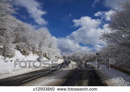 Snowcapped mountain road View Large Photo Image Stock Image - Snowcapped mountain road. Fotosearch