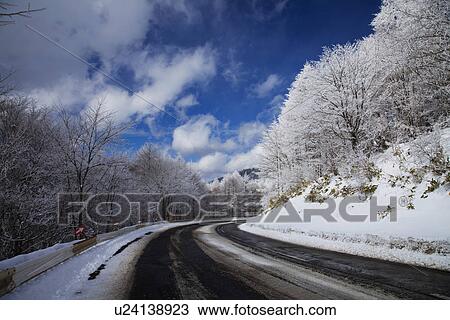 Snowcapped mountain road View Large Photo Image Stock Image - Snowcapped mountain road. Fotosearch