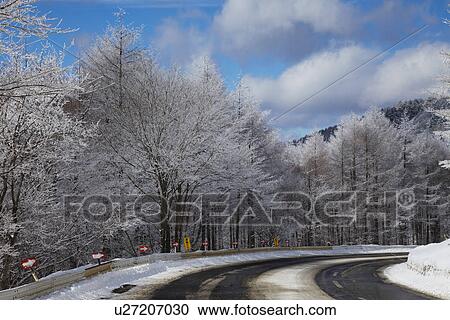Snowcapped mountain road View Large Photo Image Stock Image - Snowcapped mountain road. Fotosearch