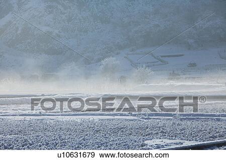 Stock Photo - Snowcapped rice fields. Fotosearch