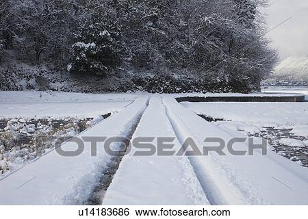 Snowcapped road View Large Photo Image Stock Photograph - Snowcapped road. Fotosearch