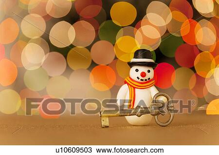 Stock Image - Snowman and Key. Fotosearch