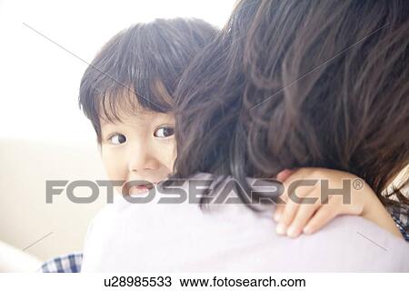 Son in mother's arms View Large Photo Image Stock Image - Son in mother's arms. Fotosearch