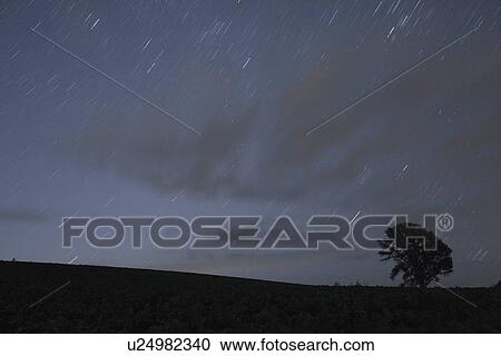 Stock Image - Starry sky at night, Biei Town, Hokkaido Prefecture, Japan. Fotosearch