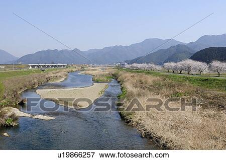 Stock Photo - Stream at bottom of mountain. Fotosearch