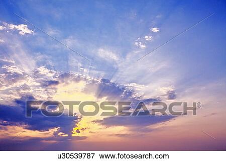 Stock Photo - Sunset and clouds. Fotosearch