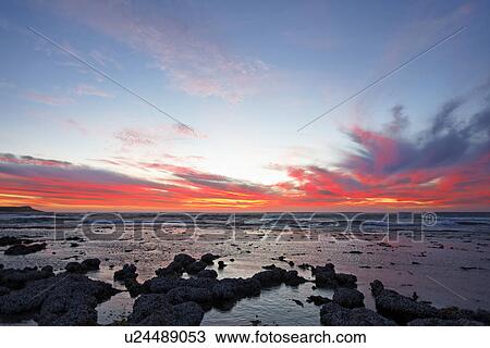 Stock Image - Sunset over sea. Fotosearch