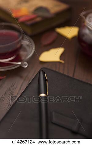 Picture - Tea, Personal Organizer and Pen. Fotosearch