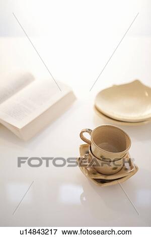 Stock Photo - Teacups and Book. Fotosearch