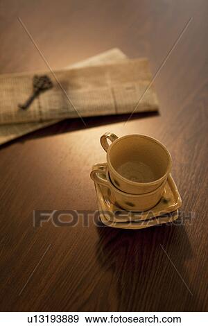 Teacups, Newspaper and Key View Large Photo Image Stock Photo - Teacups, Newspaper and Key. Fotosearch