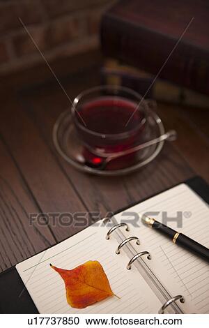 Stock Image - Teatime and a Diary. Fotosearch