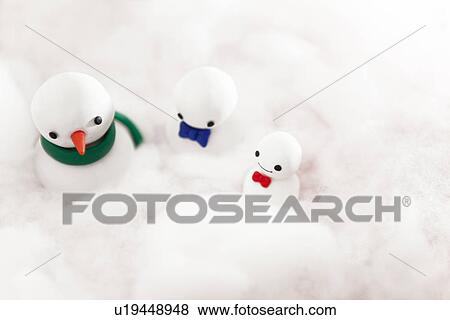 Stock Photo - Three Decorative Snowmen In Cotton Wool. Fotosearch
