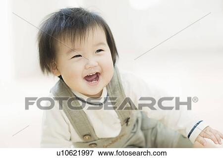 Stock Photo - Toddler laughing. Fotosearch