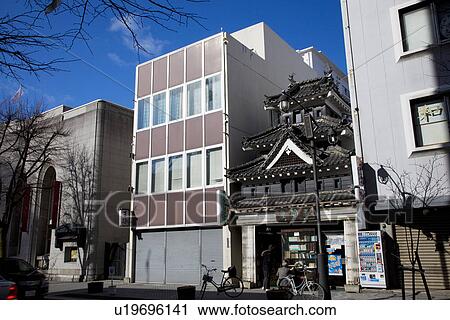Traditional house between contemporary ones View Large Photo Image Stock Image - Traditional house between contemporary ones. Fotosearch