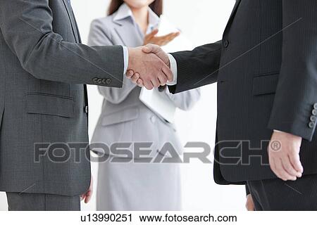 Two Businessmen Shaking Hands View Large Photo Image Stock Image - Two Businessmen Shaking Hands. Fotosearch