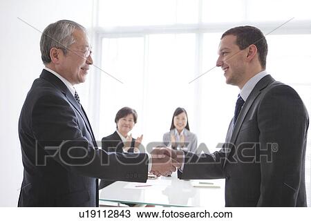 Two Businessmen Shaking Hands View Large Photo Image Stock Image - Two Businessmen Shaking Hands. Fotosearch