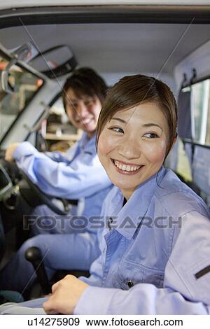 Two Car Mechanics In Car View Large Photo Image Stock Photo - Two Car Mechanics In Car. Fotosearch