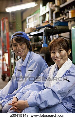 Two Factory Workers Having a Break View Large Photo Image Stock Photo - Two Factory Workers Having a Break. Fotosearch