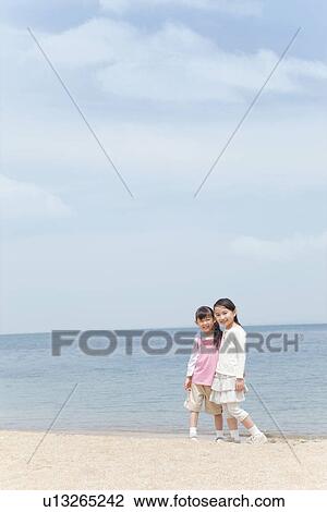 Two Girls Looking at Sea View Large Photo Image Stock Image - Two Girls Looking at Sea. Fotosearch