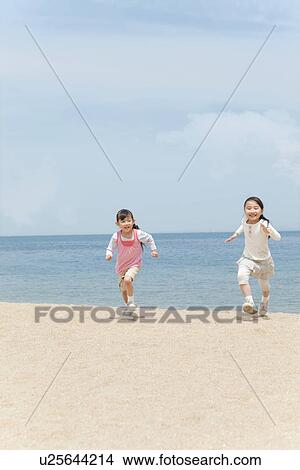 Two Girls Running on Beach View Large Photo Image Picture - Two Girls Running on Beach. Fotosearch