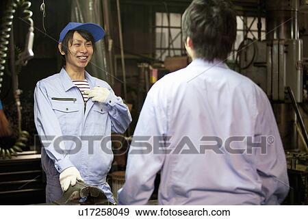 Two Male Factory Workers Talking View Large Photo Image Stock Photo - Two Male Factory Workers Talking. Fotosearch