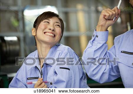 Stock Image - Two Young Factory Workers. Fotosearch