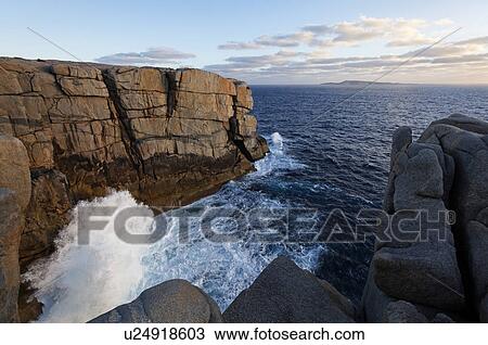 Waves breaking against cliff View Large Photo Image Stock Image - Waves breaking against cliff. Fotosearch